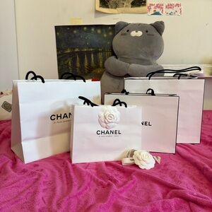CHANEL White Shopping Bags with Black Handles and Camellia Accent